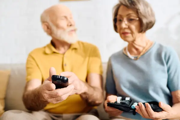 Loving couple engages in diabetes management together while sitting at home. — Stock Photo