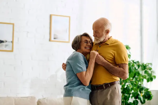 A senior couple shares a tender moment at home while supporting each other in diabetes care. — Stock Photo