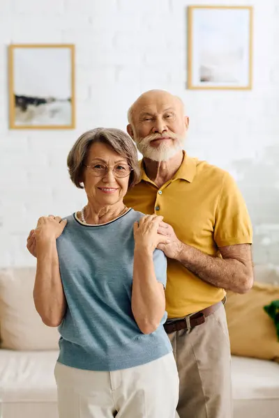 A loving senior couple shares comforting moments at home, supporting each other through challenges. — Stock Photo