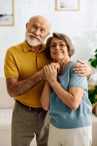 A loving senior couple enjoys a heartfelt moment at home, supporting each other through diabetes. — Stock Photo