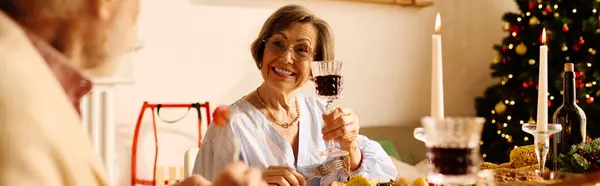 The loving couple enjoys a festive Christmas dinner at home, surrounded by holiday cheer. — Stock Photo