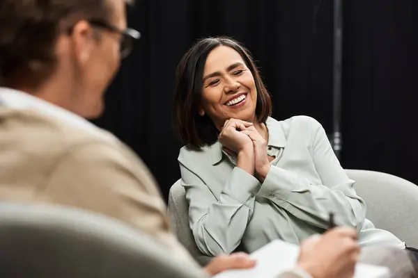A journalist interviews a specialist, creating a lively discussion filled with insights and positivity. — Stock Photo