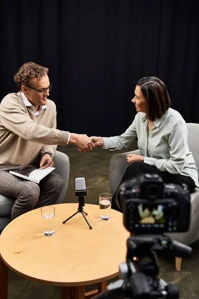 A journalist engages in a professional dialogue with a specialist, highlighting their expertise and insights. — Stock Photo