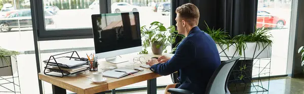 A young businessman working in a stylish office — Stock Photo