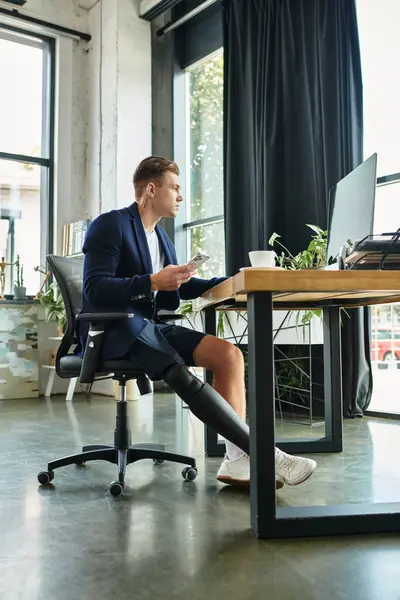 A talented and handsome young man navigates his work responsibilities confidently in a sleek office. — Stock Photo
