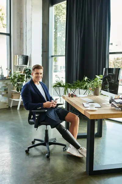 A young businessman with an artificial limb confidently works in a stylish office, embracing diversity. — Stock Photo