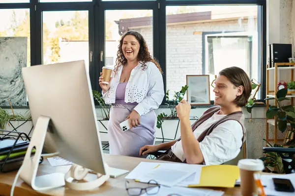 A young plus size woman enjoying a light moment with her male friend in a bright office. — Stock Photo