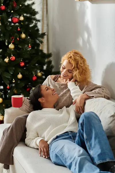 A warm moment shared by a loving couple as they enjoy their tranquil home during winter. — Stock Photo