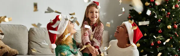 A joyful holiday celebration with a loving couple and their daughter playing and laughing together. — Stock Photo
