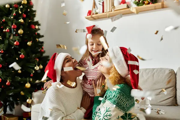 A beautiful family enjoys a festive moment together, surrounded by Christmas decorations and joy. — Stock Photo