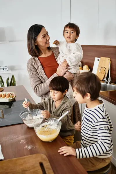 A happy grandmother enjoys baking holiday treats with her grandsons, creating cherished memories together. — Stock Photo