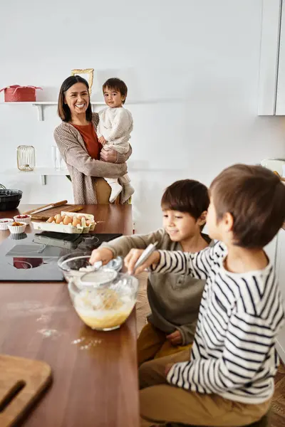 A happy grandmother shares delightful moments baking with her grandsons during the winter holidays. — Stock Photo