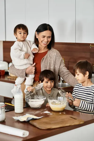 A joyful grandmother is surrounded by her grandsons as they bake delicious treats together for Christmas. — Stock Photo
