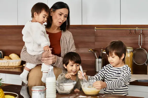 A grandmother shares laughter and baking with her grandsons in a warm kitchen before Christmas. — Stock Photo