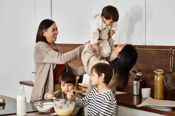 A happy family enjoys quality time in their kitchen baking delicious treats before Christmas. — Stock Photo