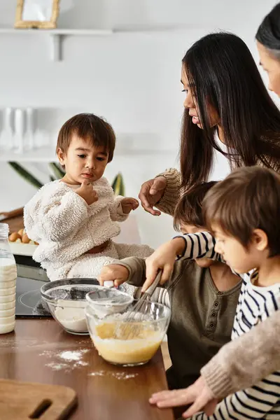 A happy family enjoys baking together in a modern kitchen, creating festive treats for the holidays. — Stock Photo