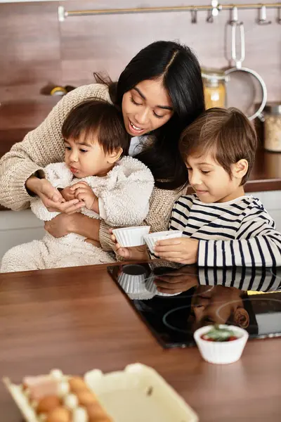 A happy family bonds while baking festive treats in their contemporary kitchen during the holiday season. — Stock Photo