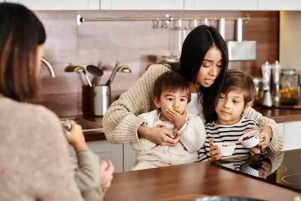 A cheerful family gathers in their modern kitchen, baking festive treats together as Christmas approaches. — Stock Photo