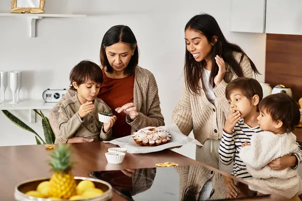 A family enjoys quality time baking festive treats, with children eagerly helping their parents in the cozy kitchen. — Stock Photo