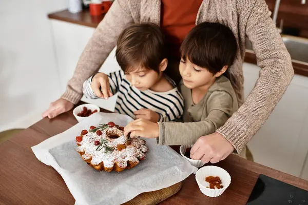 An Asian family enjoys baking together in their kitchen, making festive holiday treats with joy and laughter. — Stock Photo