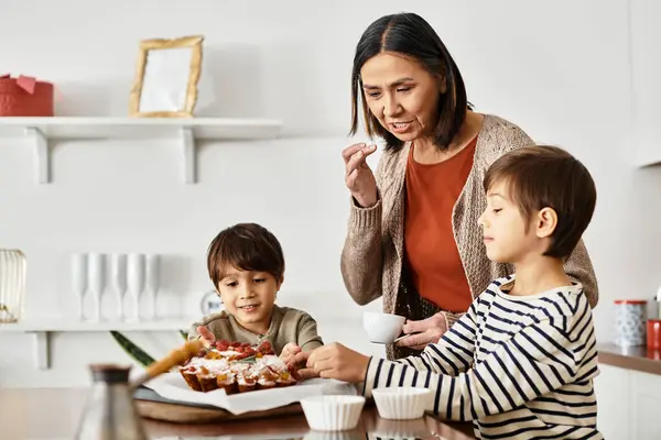 A joyful family prepares festive treats together, sharing laughter and warmth during the winter holidays. — Stock Photo