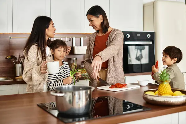 A happy family enjoys cooking together in their cozy kitchen, creating holiday delights with cheerful laughter. — Stock Photo