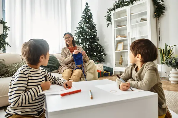 A happy family gathers in their modern living room, celebrating Christmas with love and warmth during winter. — Stock Photo
