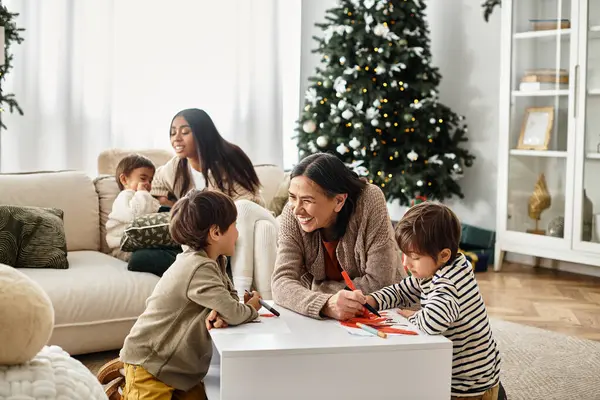 A happy family celebrates winter holidays together, creating cherished memories near their Christmas tree. — Stock Photo