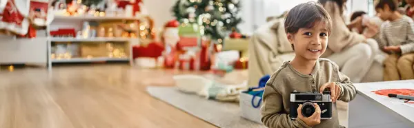 A cheerful family gathers around a beautifully decorated Christmas tree, sharing laughter and joy in winter. — Stock Photo