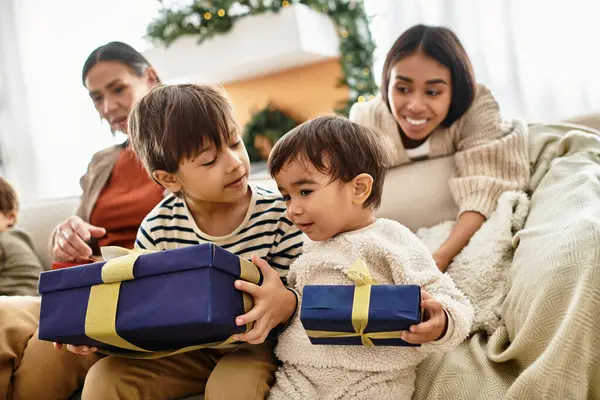 A cheerful gathering of an Asian family as they share gifts and warmth during the Christmas holiday season. — Stock Photo