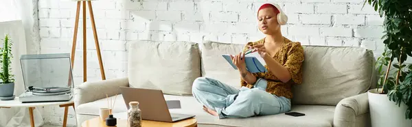 A bald woman relaxes in her stylish living room, lost in thought while writing. — Stock Photo