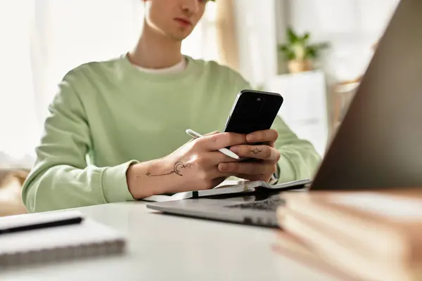 A handsome young man focuses on his tasks while working from home in a stylish, sunlit apartment. — Stock Photo