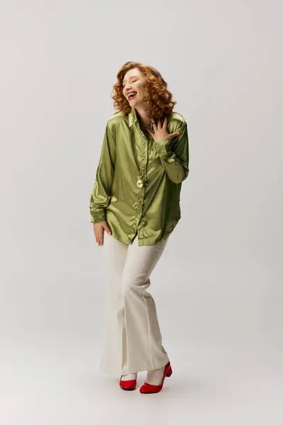 A cheerful young woman posing, expressing joy and creativity. — Stock Photo