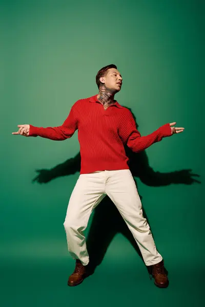 The young man showcases his tattoos while expressing vibrant energy and style. — Stock Photo