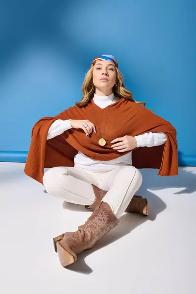 A young plus size woman sits gracefully, adorned in a chic outfit, radiating confidence and style. — Stock Photo