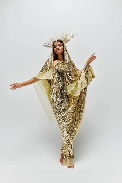 A breathtaking African American goddess captivates in a golden dress, exuding grace and glamour in a serene studio. — Stock Photo