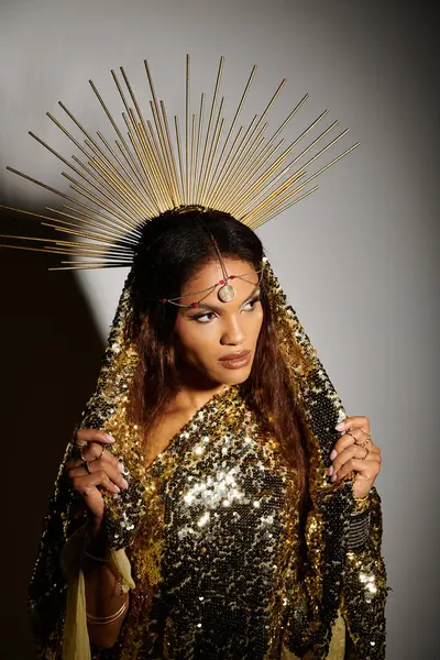 In a captivating studio, an African American goddess shines in a shimmering golden dress, exuding elegance and grace. — Stock Photo