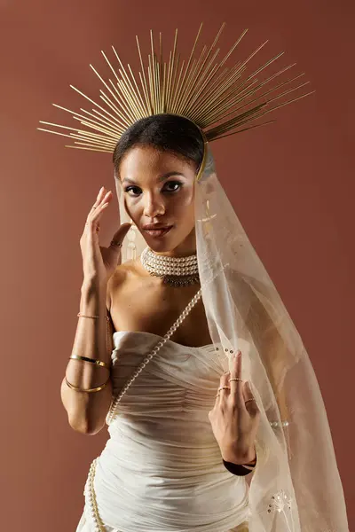 An elegant African American woman showcases her beauty in a white dress, adorned with a pearl necklace, in a studio. — Stock Photo