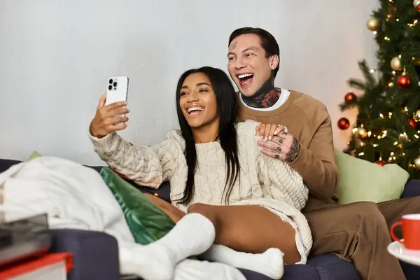 A loving couple enjoys a cheerful moment together while celebrating Christmas at home. — Stock Photo