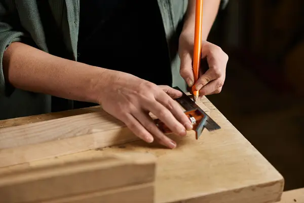 In a lively workshop, a dedicated carpenter measures wood with precision, preparing for her craft. — Stock Photo