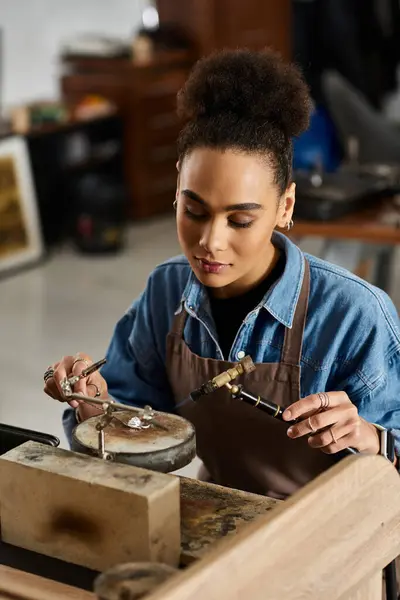 A skilled artisan works intimately with precious jewels, showcasing talent and artistry. — Stock Photo