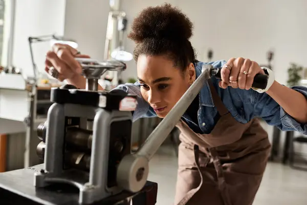 A talented woman focuses intently on her jewelry making process using precision tools. — Stock Photo