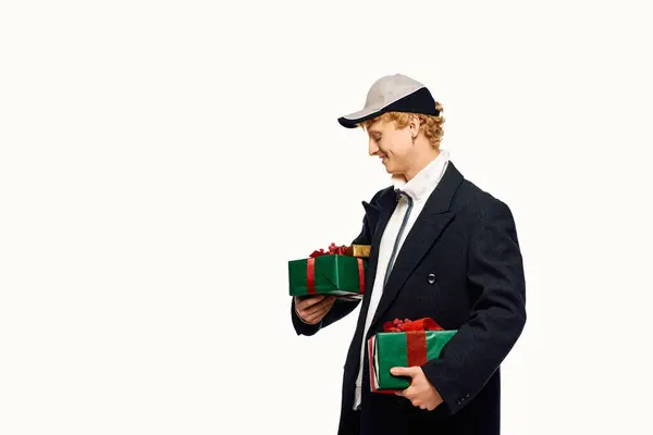 Dressed for the holiday spirit, a man showcases unique fashion with Christmas gifts in hand. — Stock Photo
