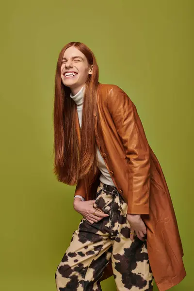 Emotionally charged moment featuring a young man with striking red hair and a stylish outfit. — Stock Photo