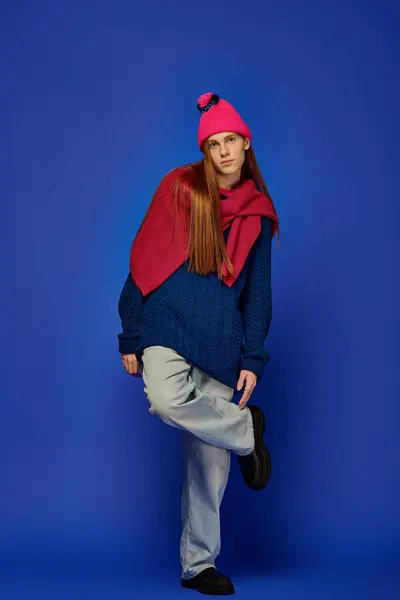 Young man with long red hair showcases his emotions while dressed in trendy attire. — Stock Photo