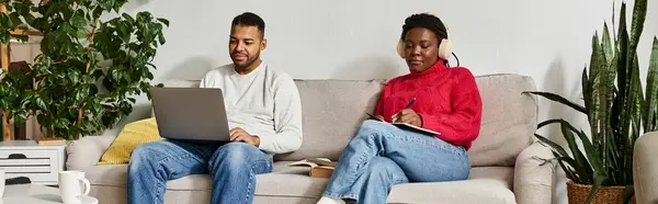 Happy couple relaxes in their living room, working and sharing quality time during winter. — Stock Photo