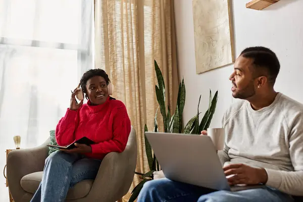Happy couple enjoys quality time together while sitting comfortably at home during winter. — Stock Photo