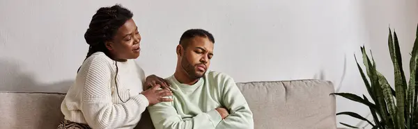 Couple wearing cozy sweaters during winter, woman calming her man — Stock Photo