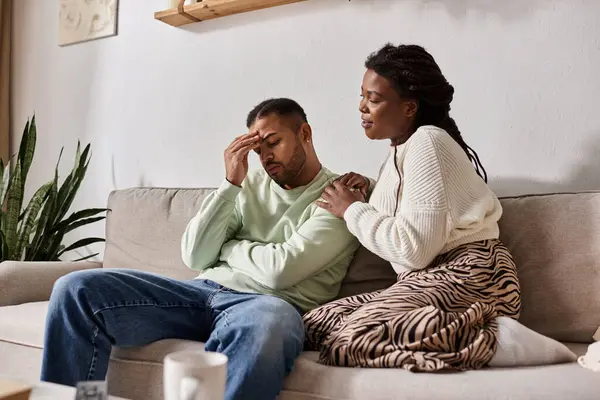 African American couple wearing cozy sweaters during winter, woman calming her sad man — Stock Photo