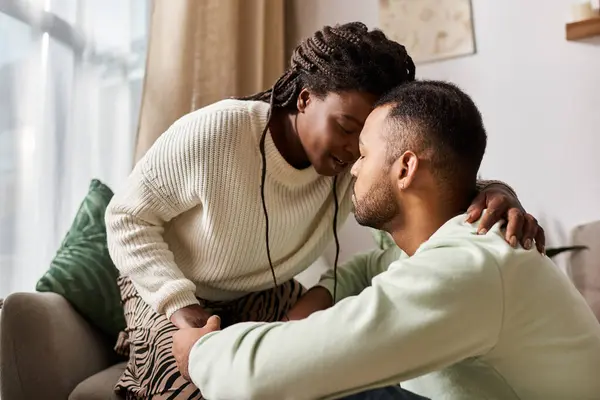 A happy couple enjoys tender moments together, embracing warmth and love this winter. — Stock Photo